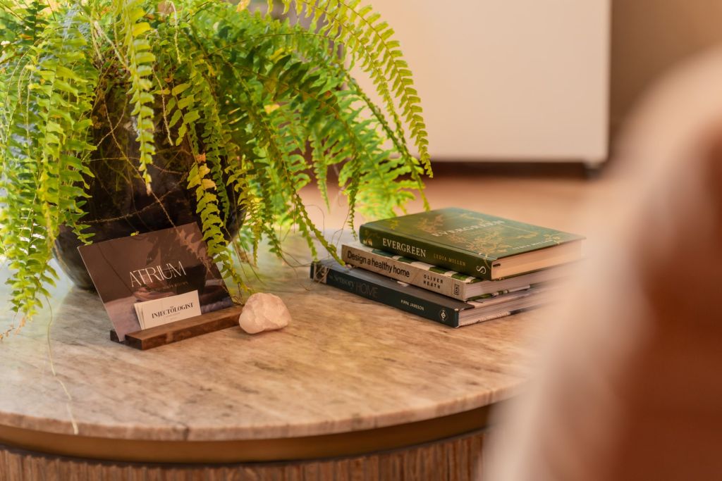 Books next to a plant